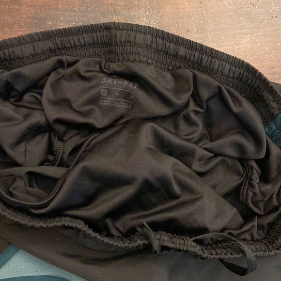 Nike DriFit running shorts, size medium. Color black and blue/turquoise - Picture 3 of 4